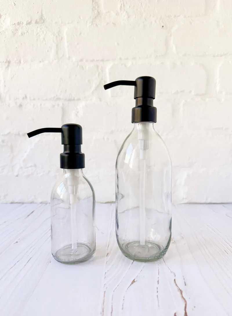 Clear Glass Dispenser Bottle with Matte Black Pump - Amenities & Co.